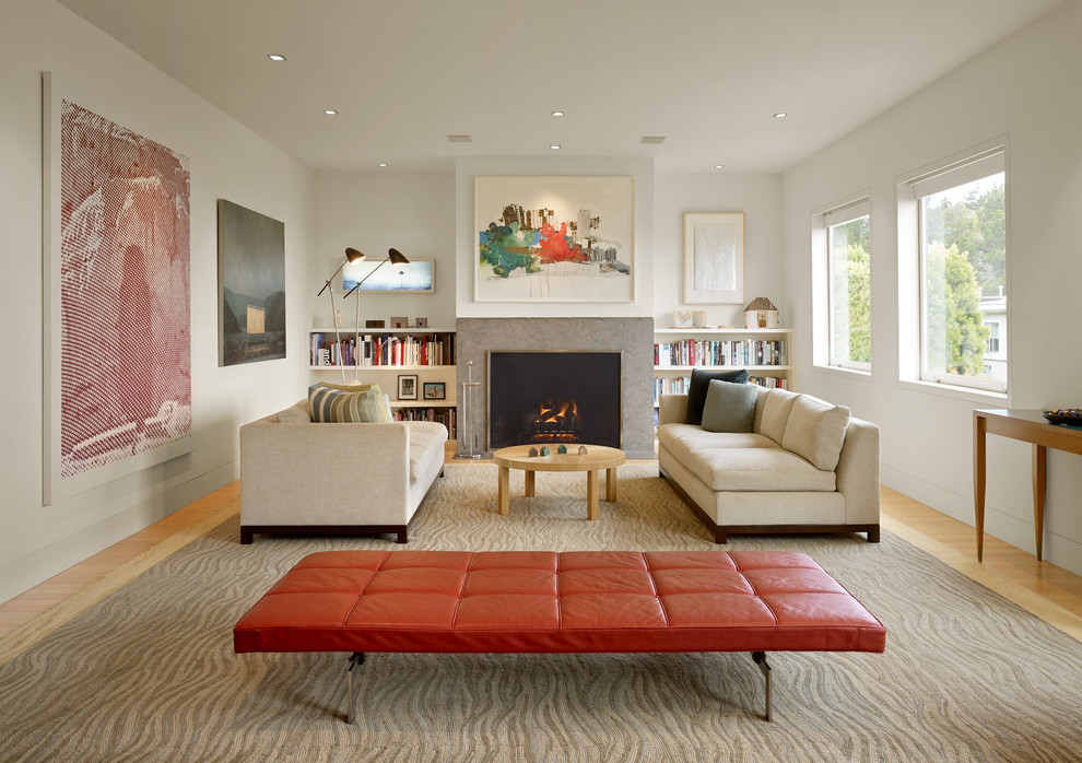 Large scandinavian formal living room in San Francisco with white walls, light hardwood floors, a standard fireplace and a stone fireplace surround.
