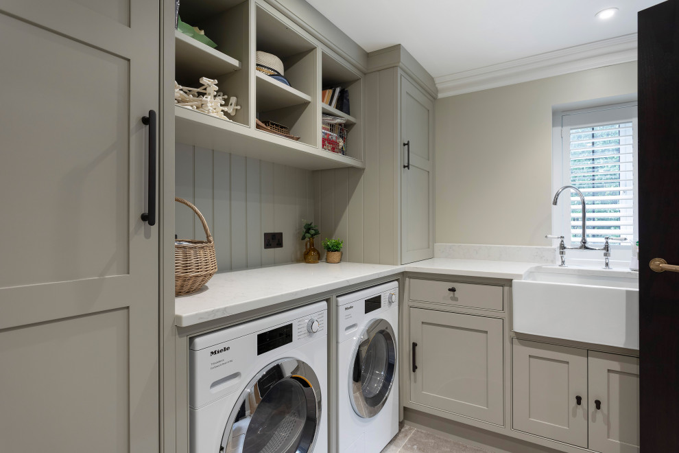This is an example of a contemporary laundry room in Surrey.