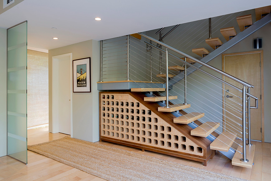 Photo of a mid-sized contemporary wood floating staircase in San Francisco with wood risers.