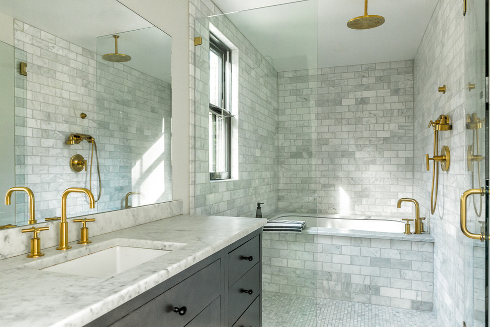 This is an example of a transitional bathroom in Portland Maine with flat-panel cabinets, grey cabinets, an undermount tub, gray tile, white tile, white walls, mosaic tile floors, an undermount sink and an open shower.
