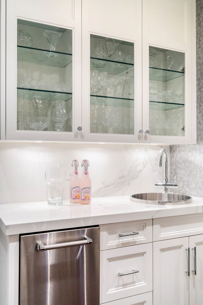 Inspiration for a large transitional galley porcelain tile eat-in kitchen remodel in New York with a double-bowl sink, shaker cabinets, white cabinets, marble countertops, multicolored backsplash, porcelain backsplash, stainless steel appliances and an island