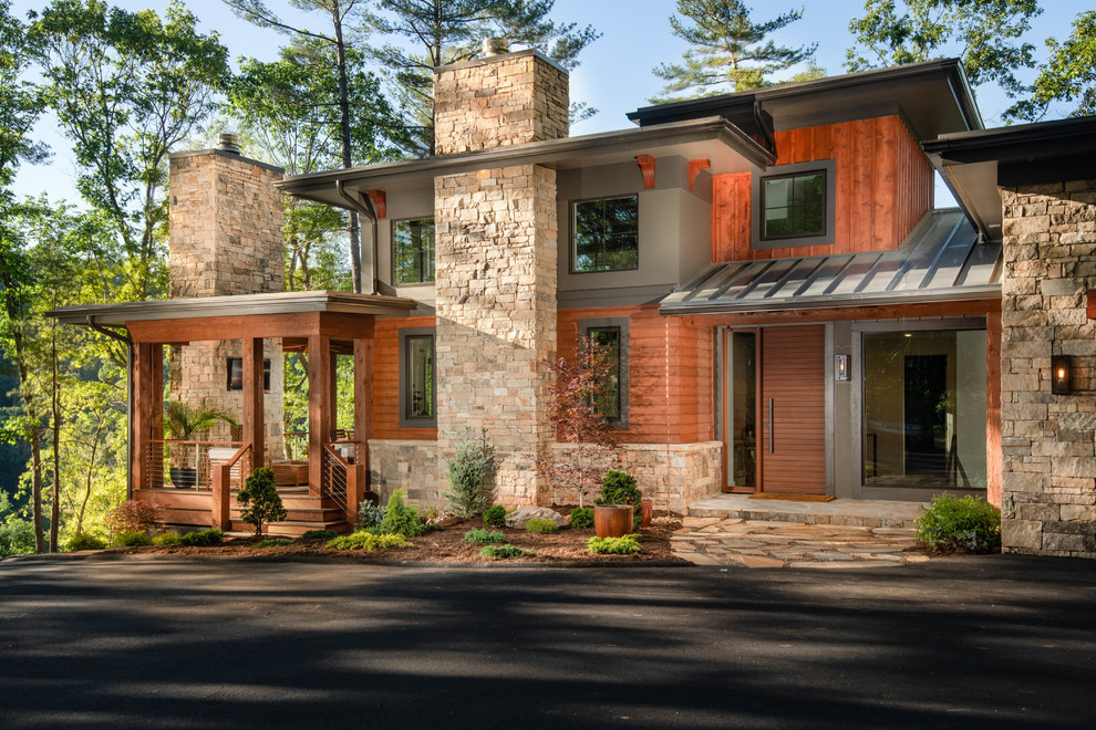Organic Modern Mountain Home - A stunning rustic modern exterior blends organic materials and sleek design in this energy-efficient mountain retreat, showcasing sustainable construction and luxurious craftsmanship.