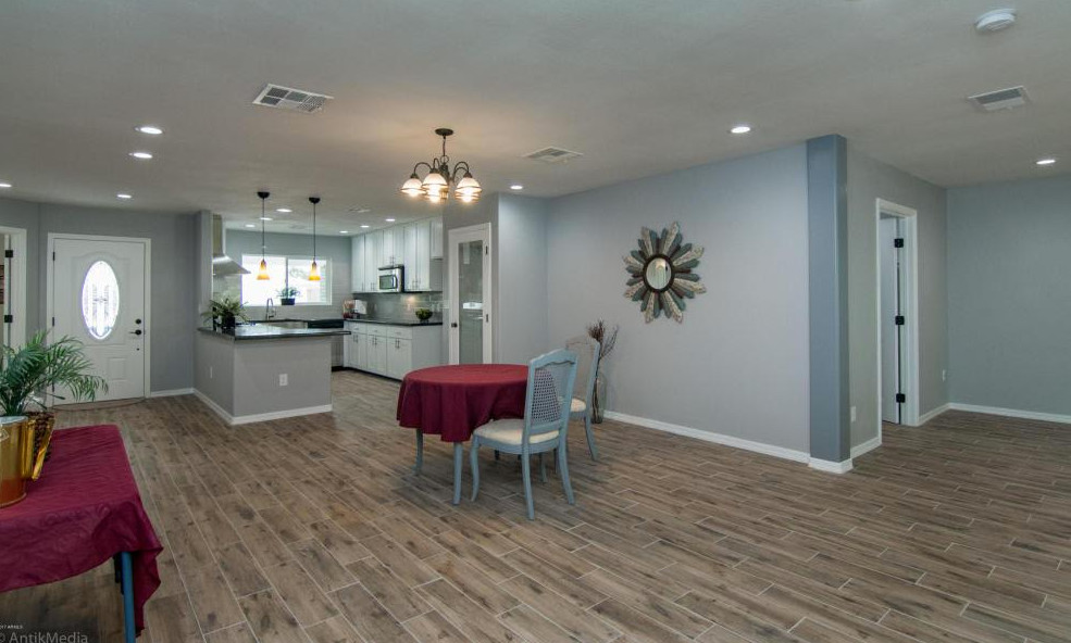 Great room - large great room idea in Phoenix with gray walls