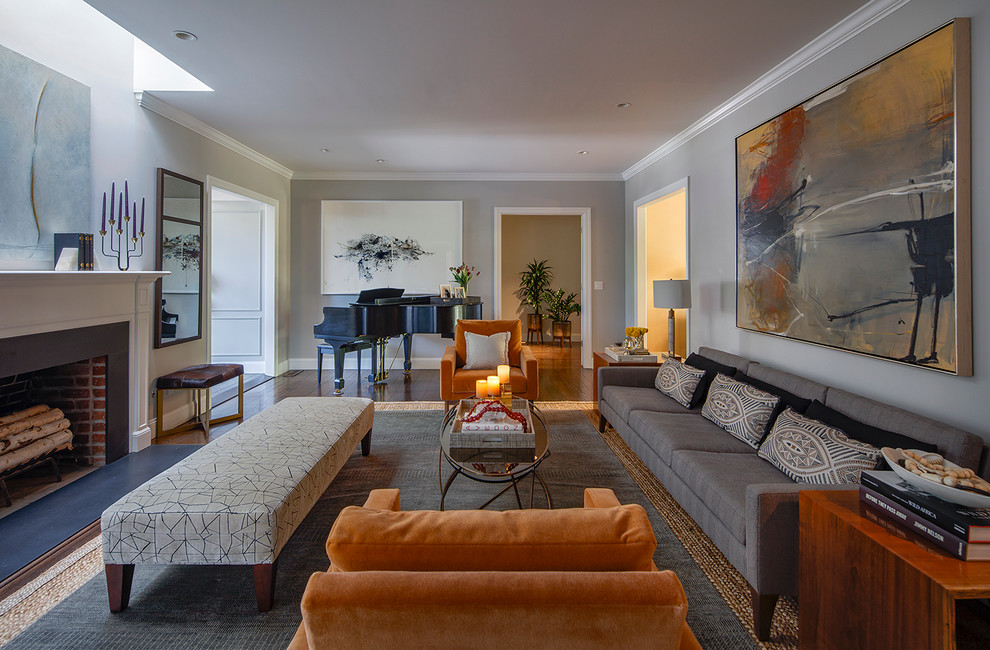 Design ideas for a large midcentury open concept living room in San Francisco with a music area, grey walls, medium hardwood floors, a standard fireplace and a wood fireplace surround.