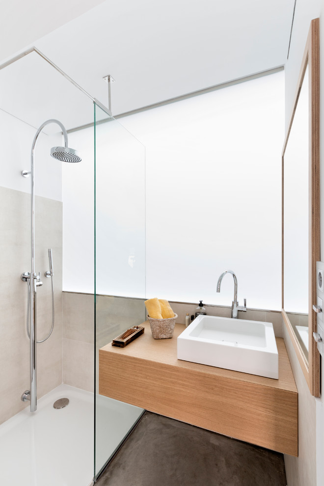 Photo of a mid-sized contemporary 3/4 bathroom in London with light wood cabinets, an open shower, white tile, glass sheet wall, white walls, concrete floors, wood benchtops, an open shower and brown benchtops.
