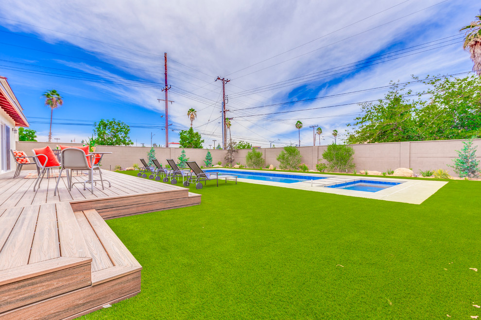Example of a large transitional backyard concrete and rectangular lap hot tub design in Orange County