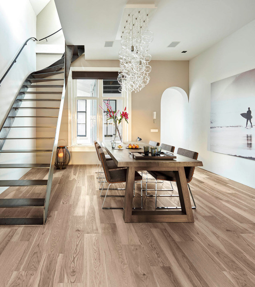 Design ideas for a small contemporary kitchen/dining combo in Sydney with beige walls, porcelain floors and brown floor.
