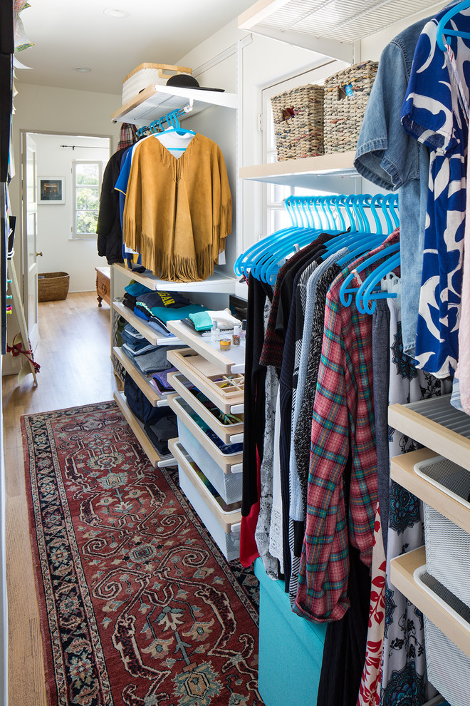 Inspiration for a transitional light wood floor hallway remodel with white walls