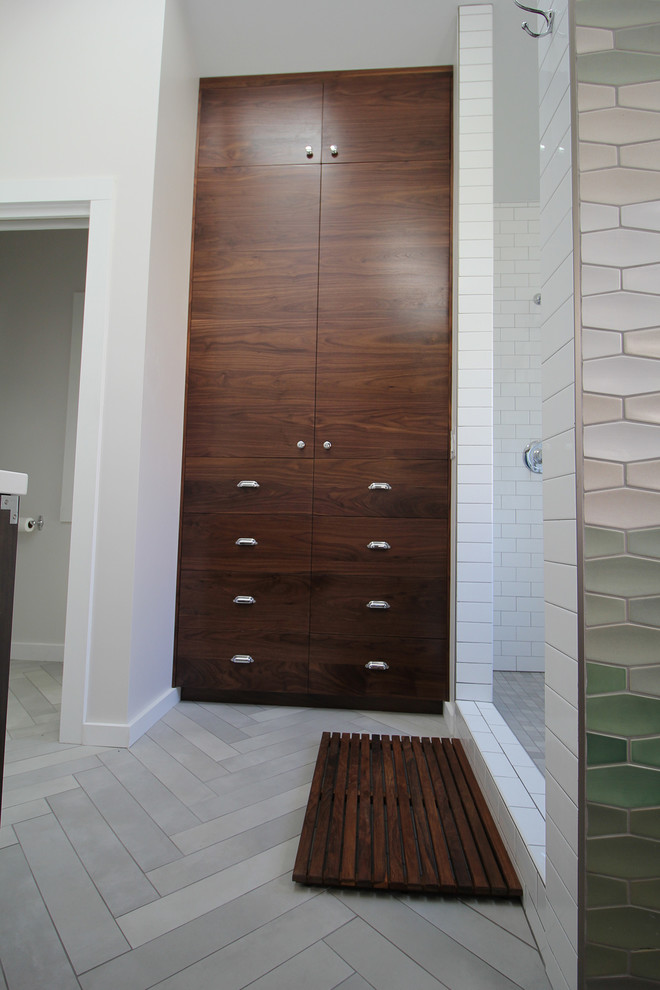 Photo of a mid-sized arts and crafts master bathroom in San Francisco with furniture-like cabinets, dark wood cabinets, an alcove shower, a one-piece toilet, white tile, glass tile, white walls, cement tiles, an undermount sink, grey floor and an open shower.