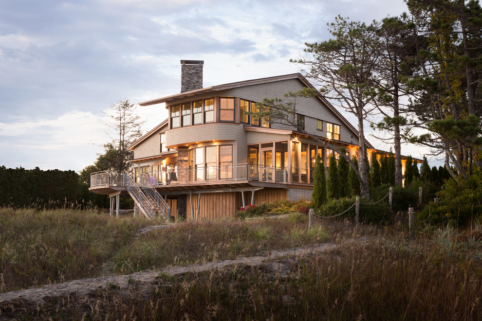This is an example of a beach style home design in Portland Maine.