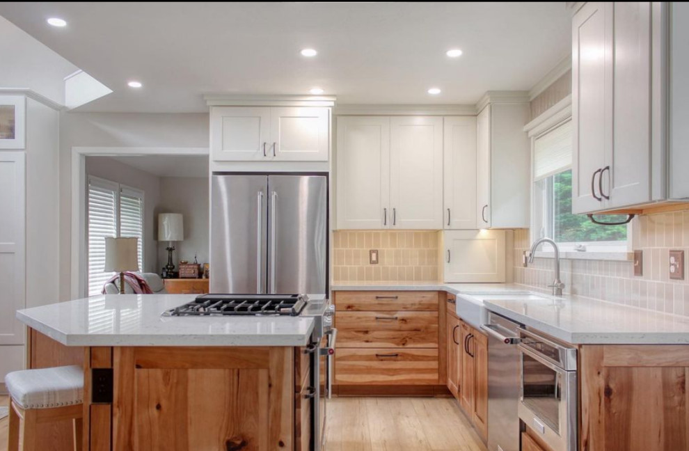 Kitchen - mid-sized kitchen idea with flat-panel cabinets, brown cabinets and an island