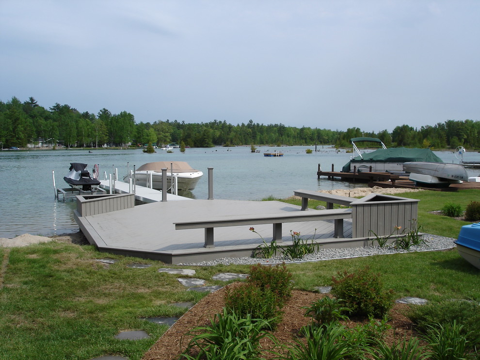 Inspiration for a mid-sized coastal backyard deck remodel with no cover