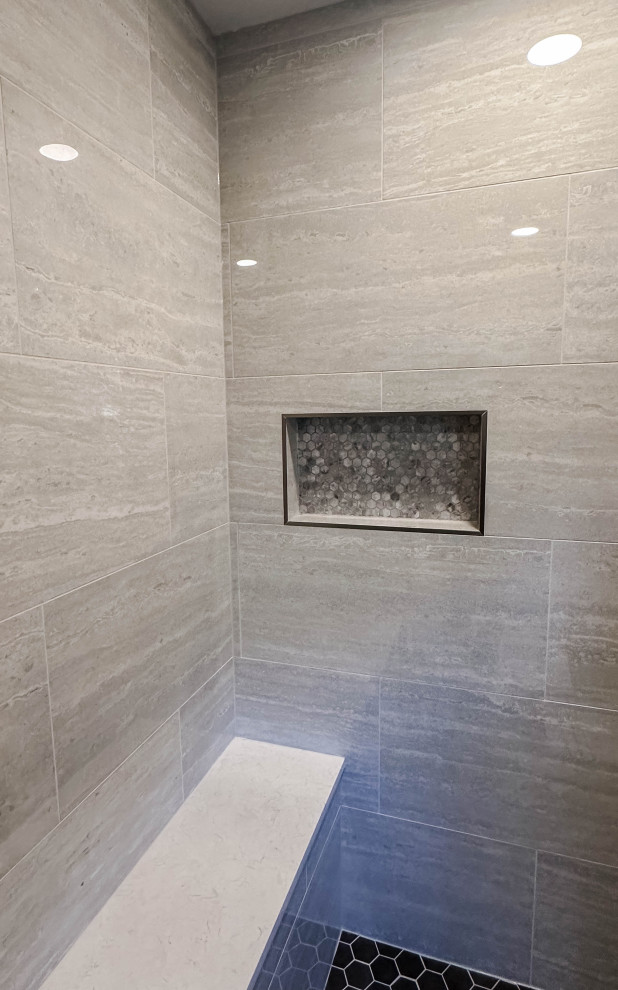 Inspiration for a large transitional master gray tile and porcelain tile porcelain tile and black floor walk-in shower remodel with gray walls and a hinged shower door