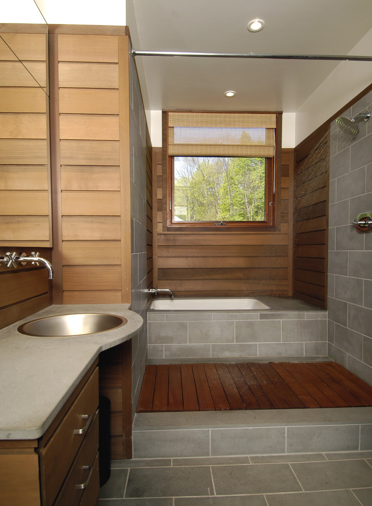 This is an example of a contemporary bathroom in Boston with an open shower and a shower curtain.