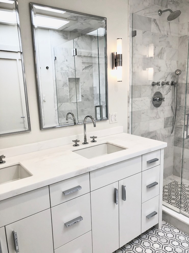 Mid-sized contemporary master bathroom in New York with flat-panel cabinets, white cabinets, an open shower, a wall-mount toilet, gray tile, marble, white walls, mosaic tile floors, an undermount sink, marble benchtops, grey floor, a hinged shower door and white benchtops.