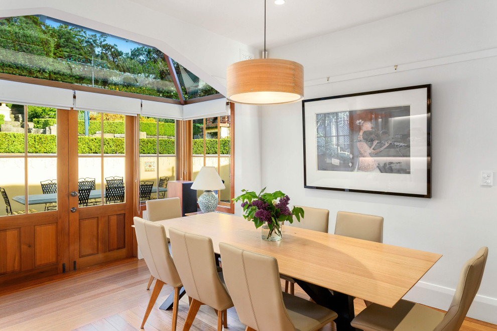 Example of a trendy dining room design in Hobart