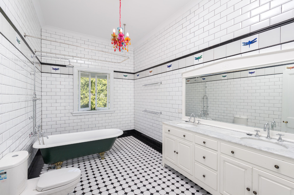Traditional bathroom in Brisbane with raised-panel cabinets, white cabinets, a claw-foot tub, a shower/bathtub combo, a two-piece toilet, black tile, white tile, subway tile, white walls, ceramic floors and an undermount sink.