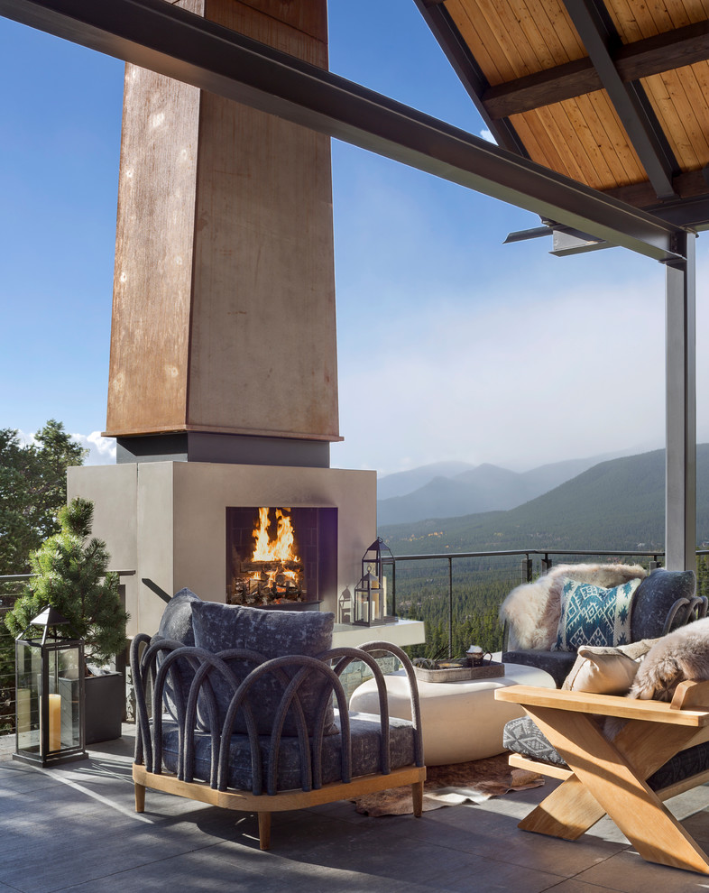 Example of a mountain style home design design in Denver