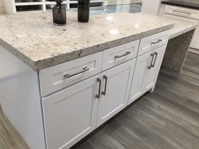 Design ideas for a mid-sized transitional l-shaped separate kitchen in Orange County with white cabinets, grey splashback, mosaic tile splashback, stainless steel appliances, dark hardwood floors, shaker cabinets, granite benchtops, with island and grey floor.