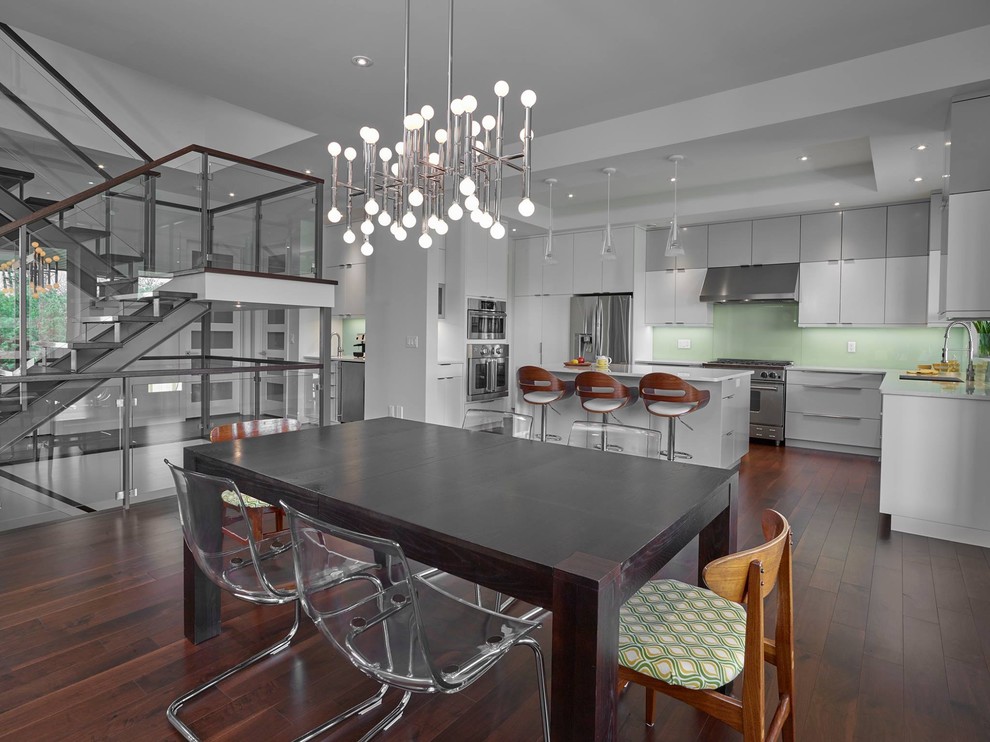 Expansive contemporary kitchen/dining combo in Edmonton with white walls, dark hardwood floors and no fireplace.