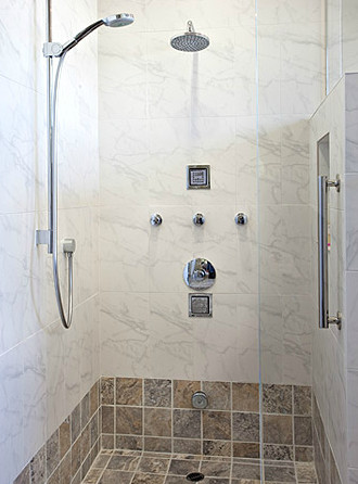 Mid-sized transitional master gray tile and marble tile gray floor corner shower photo with white walls, flat-panel cabinets, dark wood cabinets, a two-piece toilet, an undermount sink, quartz countertops and a hinged shower door