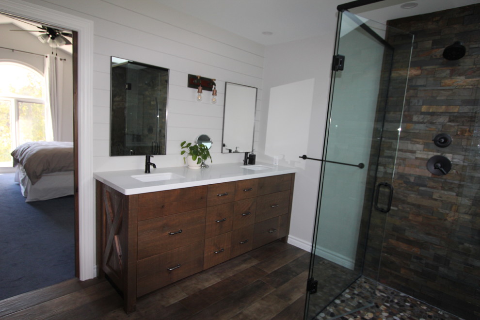 Inspiration for a rustic porcelain tile and brown floor corner shower remodel with flat-panel cabinets, distressed cabinets, an undermount sink, quartz countertops and white countertops