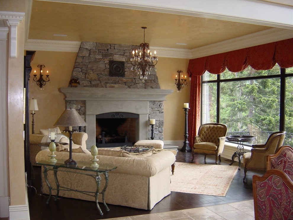 This is an example of a mid-sized traditional formal enclosed living room in Vancouver with beige walls, dark hardwood floors, a standard fireplace, a concrete fireplace surround and brown floor.