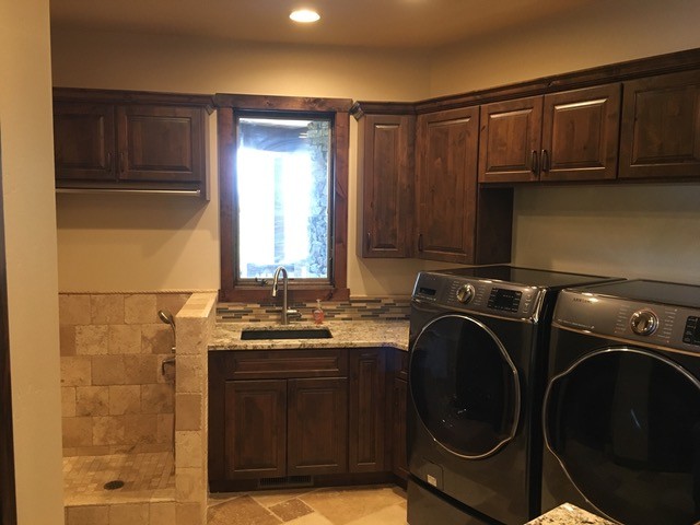This is an example of a country laundry room in Other.