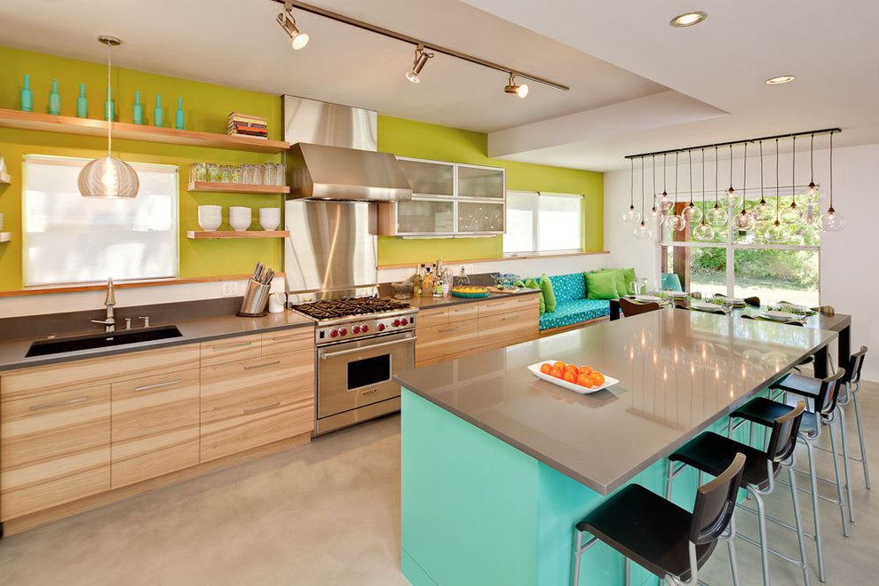 This is an example of a contemporary eat-in kitchen in Austin with stainless steel appliances, open cabinets, a single-bowl sink, medium wood cabinets and quartz benchtops.