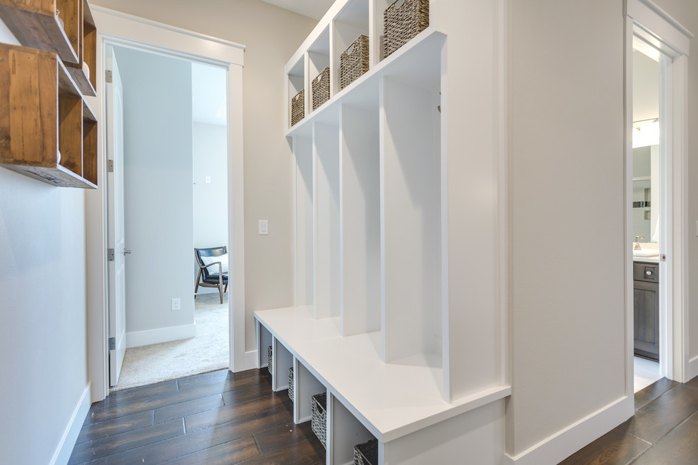 Inspiration for a mid-sized transitional hallway in Portland with beige walls and dark hardwood floors.
