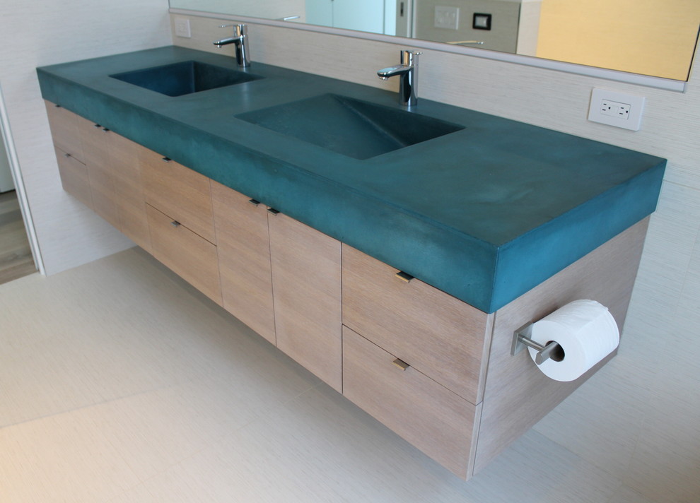 This is an example of a mid-sized modern kids bathroom in San Francisco with flat-panel cabinets, light wood cabinets, concrete benchtops, an integrated sink, porcelain floors, turquoise benchtops, white tile, porcelain tile, white walls and white floor.