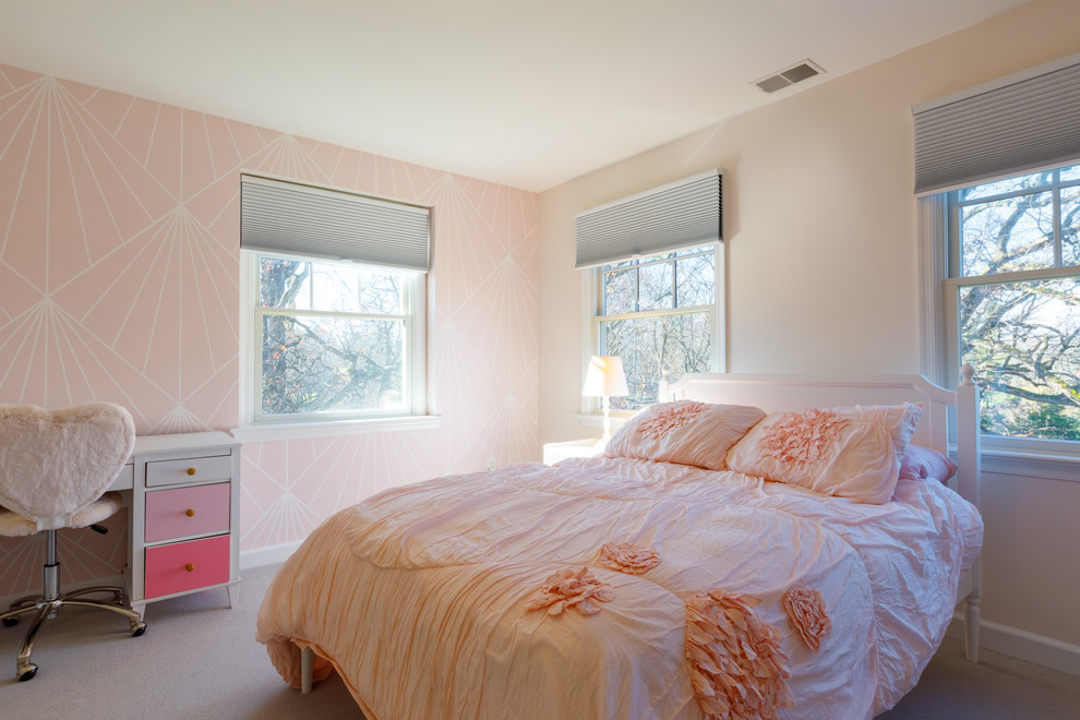 Photo of a transitional kids' bedroom for girls in Other with pink walls, carpet and grey floor.