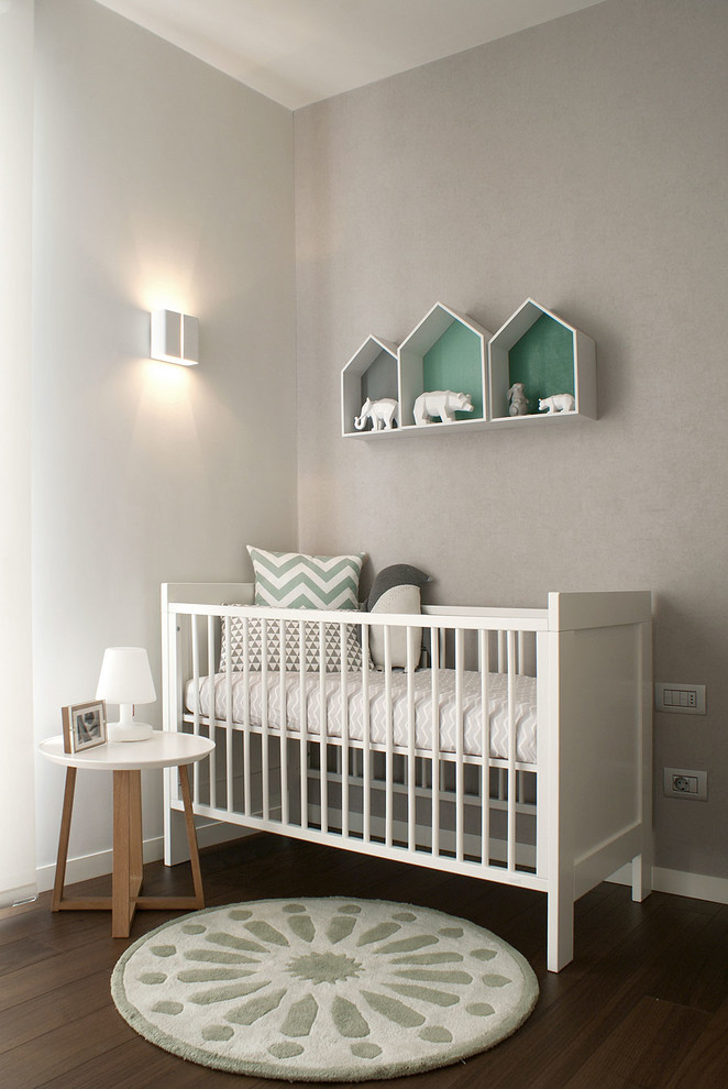 Design ideas for a mid-sized contemporary nursery for boys in Alicante-Costa Blanca with grey walls, dark hardwood floors and brown floor.