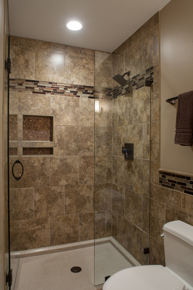 Photo of a mid-sized transitional bathroom in Kansas City with an undermount sink, recessed-panel cabinets, medium wood cabinets, engineered quartz benchtops, an alcove shower, beige tile, porcelain tile, beige walls and porcelain floors.