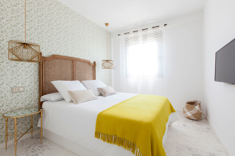 Design ideas for a mid-sized tropical master bedroom in Madrid with multi-coloured walls, no fireplace and white floor.