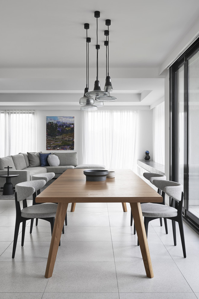 Inspiration for a modern open plan dining in Melbourne with white walls and grey floor.