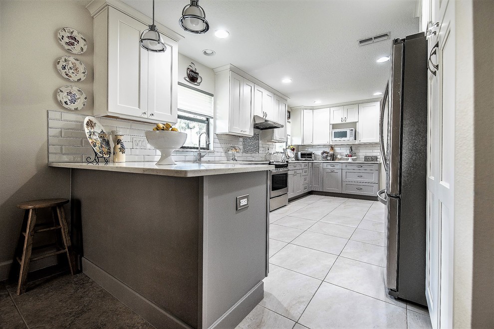 Example of a transitional kitchen design in Orlando