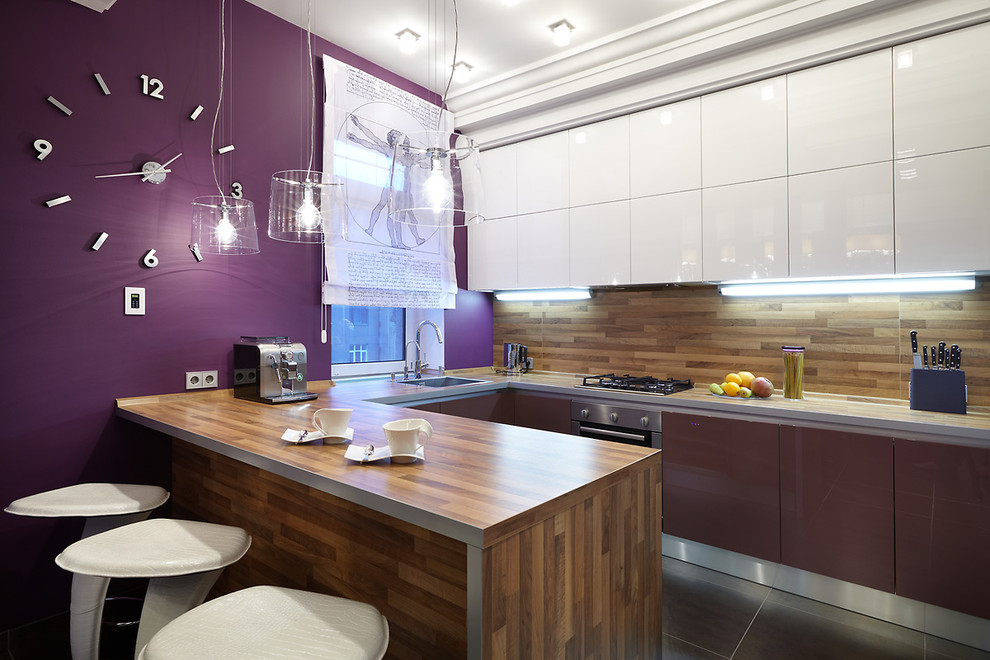 This is an example of a contemporary u-shaped kitchen in Saint Petersburg with a drop-in sink and a peninsula.