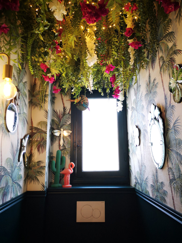 World-inspired cloakroom in Other with a wall mounted toilet, green walls, a wall-mounted sink and wallpapered walls.