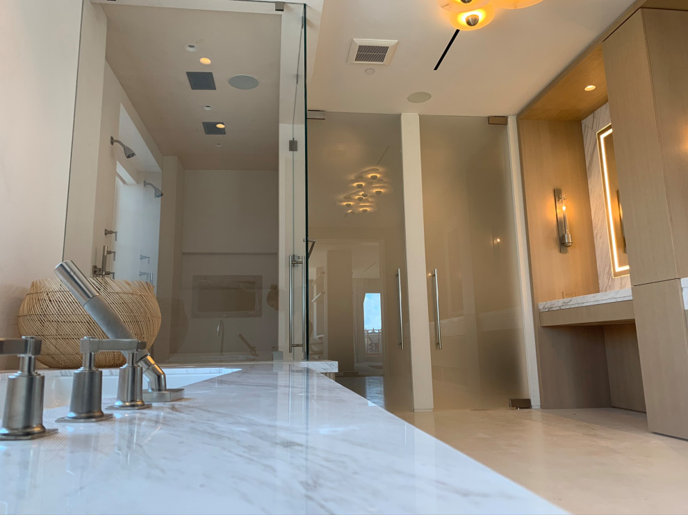 Expansive contemporary master bathroom in Miami with a hinged shower door.