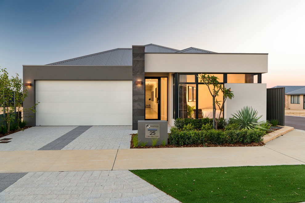 Design ideas for a mid-sized contemporary one-storey white house exterior in Perth with stone veneer, a hip roof and a metal roof.