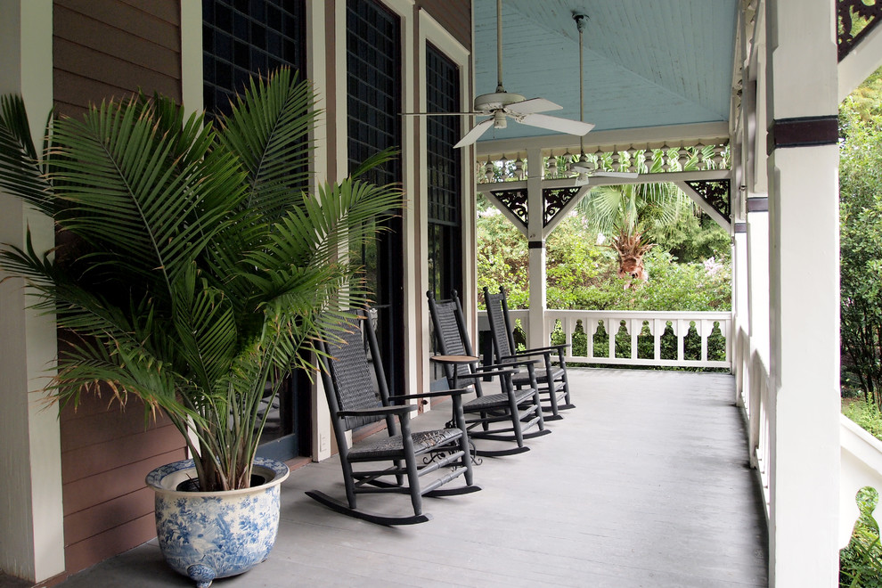 Inspiration for a beach style verandah in New Orleans with decking and a roof extension.
