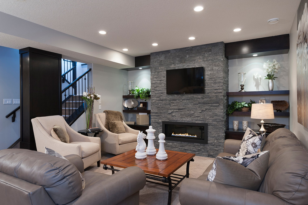 Transitional living room in Calgary with a ribbon fireplace and a stone fireplace surround.