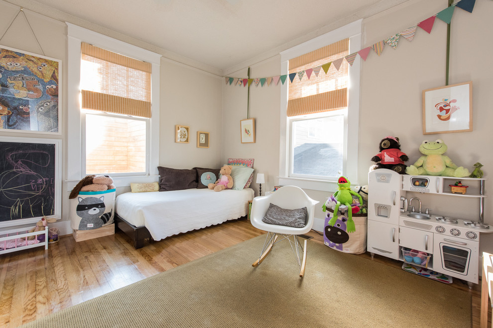Traditional Kids - Bedroom elegant girl medium tone wood floor kids' bedroom photo in Birmingham with beige walls