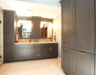 Double vanity with grey stained cabinets and tall linen ...