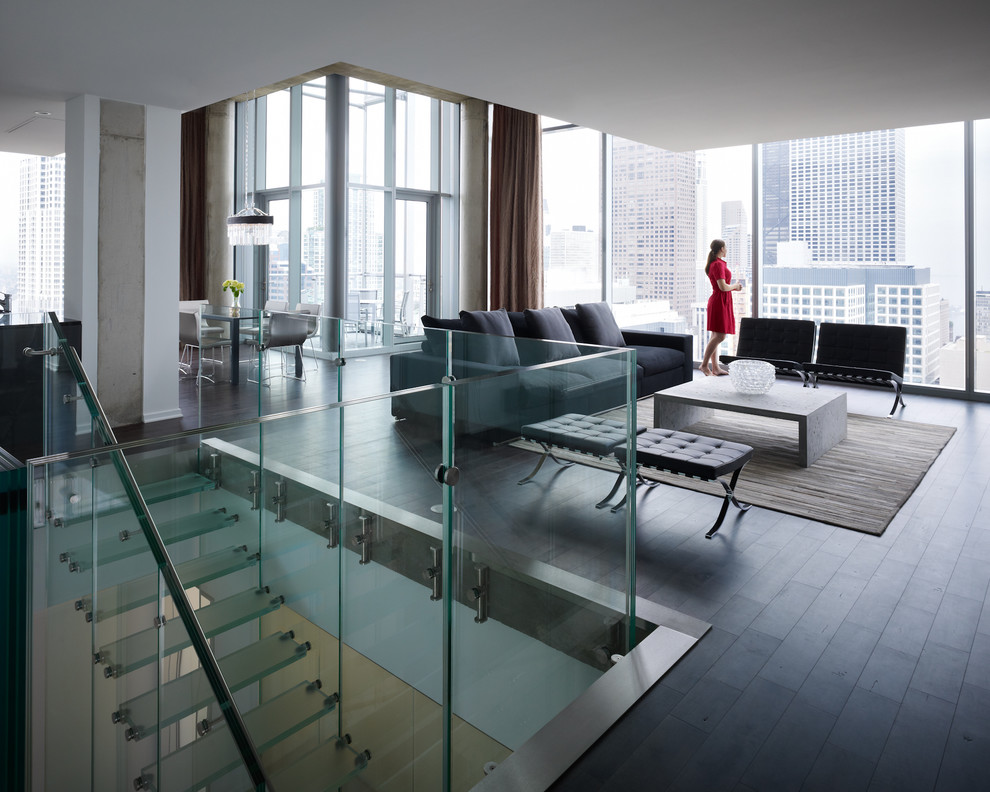 Inspiration for a mid-sized modern glass u-shaped staircase in Chicago with open risers.