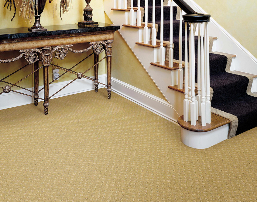 Inspiration for a small contemporary foyer in Kansas City with yellow walls and carpet.