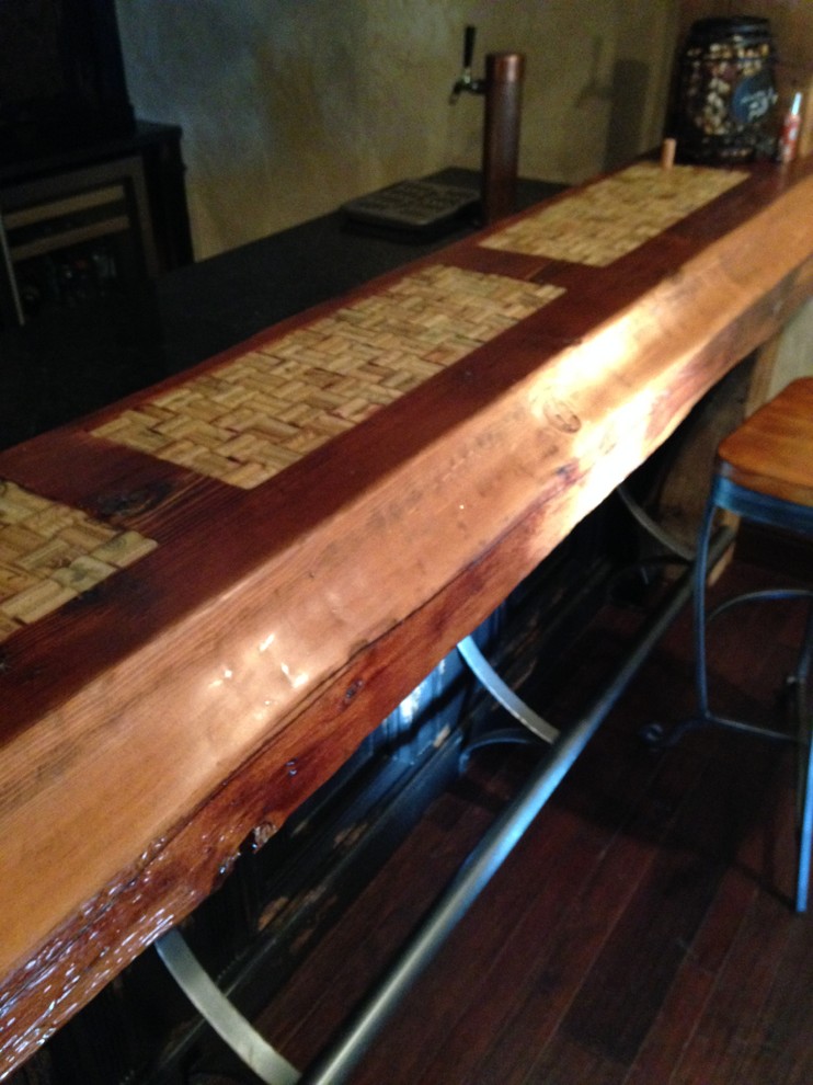 Mid-sized mountain style single-wall seated home bar photo with dark wood cabinets