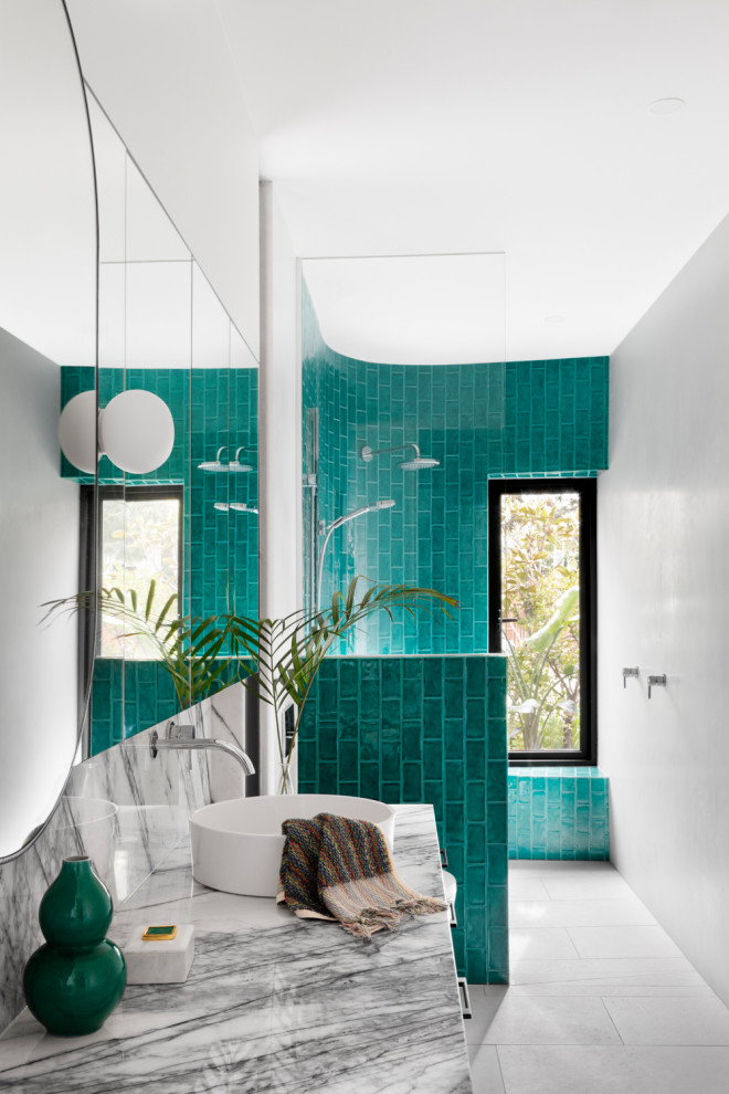 Photo of a small eclectic master wet room bathroom in Melbourne with flat-panel cabinets, black cabinets, a wall-mount toilet, green tile, porcelain tile, white walls, limestone floors, a vessel sink, marble benchtops, grey floor, an open shower and multi-coloured benchtops.