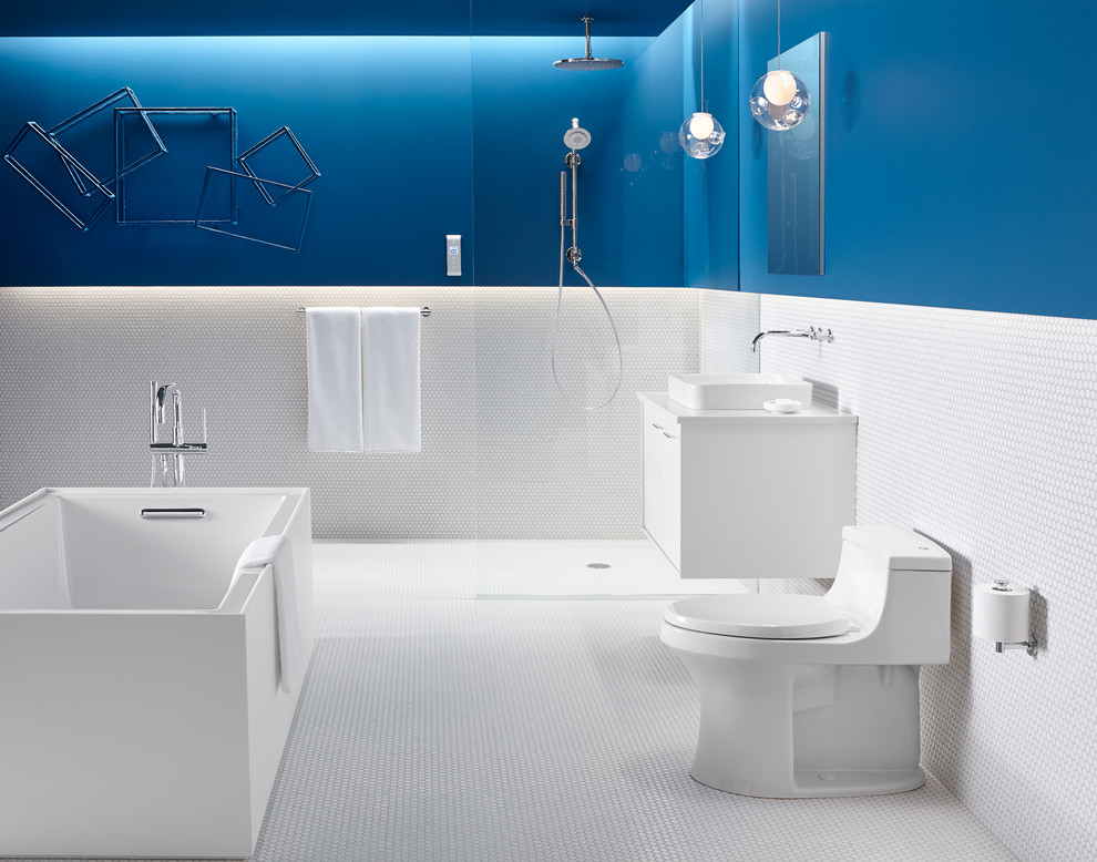 Design ideas for a large contemporary master bathroom in Milwaukee with a vessel sink, flat-panel cabinets, white cabinets, a drop-in tub, an open shower, a one-piece toilet, white tile, ceramic tile, green walls and ceramic floors.